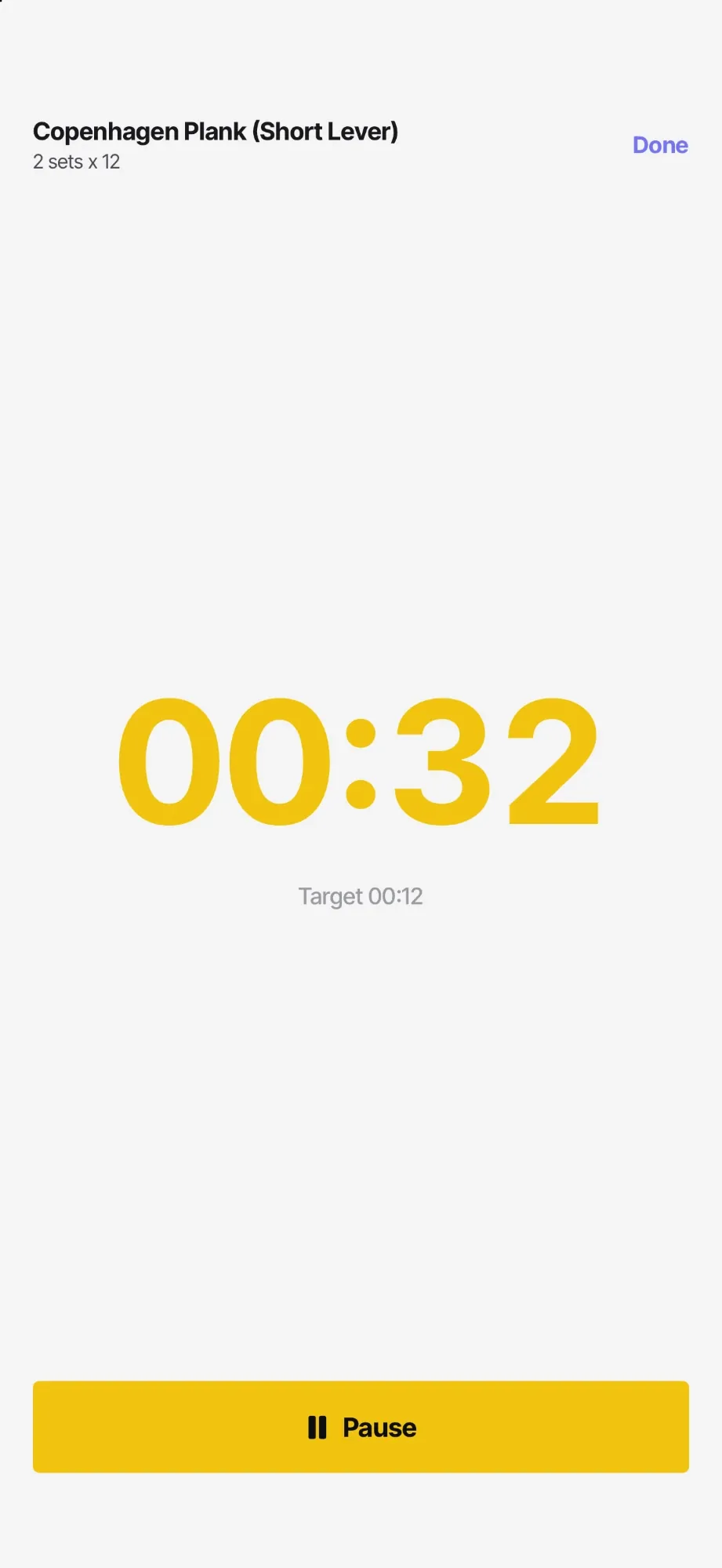 The full-screen timer for Copenhagen Plank (Short Lever), running at 00:32 in large yellow digits now that its target is met, with a Pause button below.